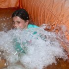 This youngster enjoys a refreshing dip at National Night Out.